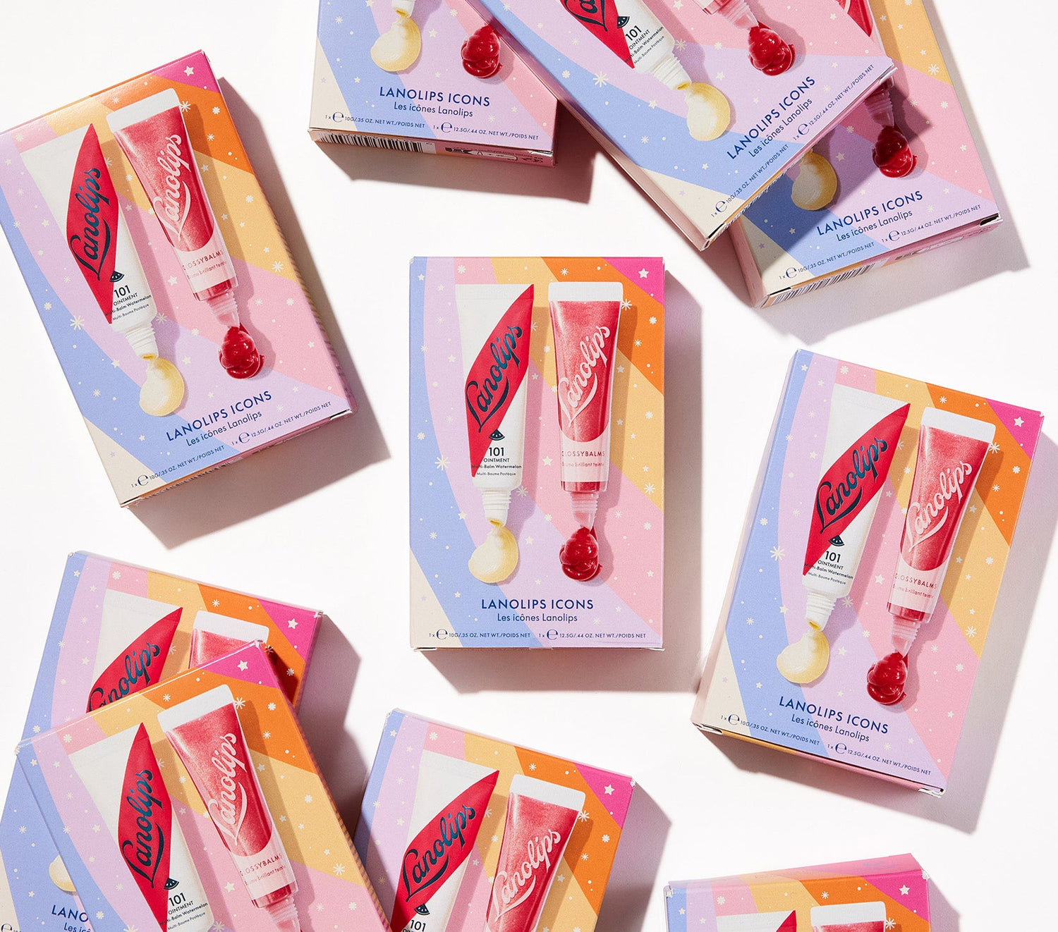 Lanolips 101 Icons Duo shown with festive tones, featuring 101 Ointment Watermelon and Glossy Balm Candy. This limited-edition set hydrates and adds shine, perfect for a glossy holiday pout. Infused with natural watermelon extract, vitamin E, and a touch of gold shimmer, it's the ultimate stocking filler for beauty lovers.