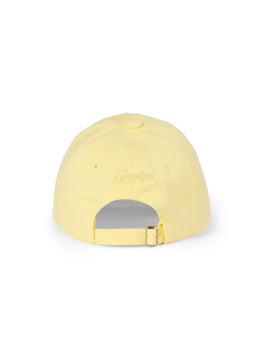 Lanolips Classic Drip Yellow Cap showcases a back view with an adjustable slider fastening, allowing you to easily customise the fit for most head sizes. The cap also features the iconic Lanolips logo on the back, adding a touch of brand flair to your style.