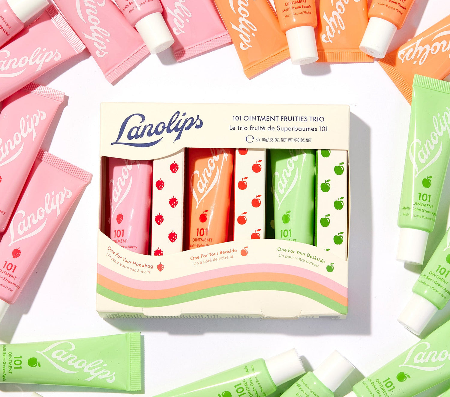 Lanolips 101 Fruities Trio set displayed with colourful tubes of lip balm. Voted the World’s Best Lip Balm by Reddit and The Times UK, this balm is made with ultra-pure Aussie lanolin. Infused with vitamin E and natural fruit extracts, it provides long-lasting hydration for dry lips, skin patches, cuticles, and elbows. This 100% natural, vegetarian formula holds 200% of its weight in moisture for deep nourishment. The set includes three best-selling flavours—Strawberry, Peach, and Green Apple.