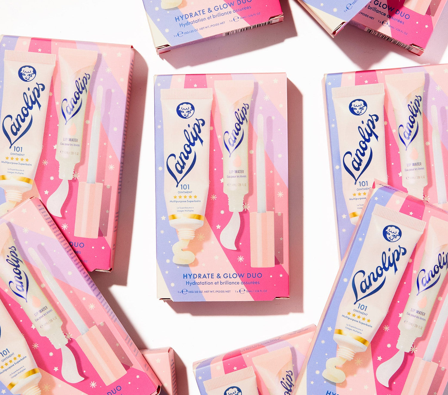 Flat lay of Lanolips Hydrate & Glow Duo gift sets, featuring Original 101 Ointment and Liquid Lip Water. This festive duo delivers intense hydration and a dewy glow for dry, chapped lips. Made with ultra-pure lanolin, hyaluronic acid, glycerin, and peppermint, it’s the perfect holiday lip care combo.
