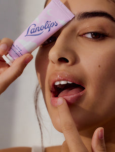 Model applying Lanolips 12 Hour Overnight Lip Mask