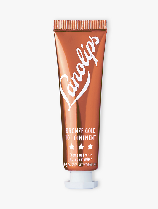 Product shot of the Lanolips Bronze Gold 101 Ointment, featuring the closed tube. Intense lanolin hydration meets a sun kissed glow.