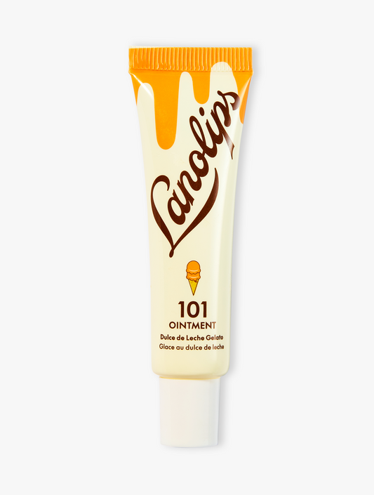 Product shot of the Lanolips 101 Ointment Multi-Balm Dulce De Leche Gelato, featuring the closed tube. 101 Ointment Multi-Balm Dulce De Leche Gelato is part  of our 101 Delicious lip balm flavours range. The World's Best Lip Balm infused with coconut oil, vitamin E & all-natural caramel flavour for a naturally sweet hydration boost throughout your day.