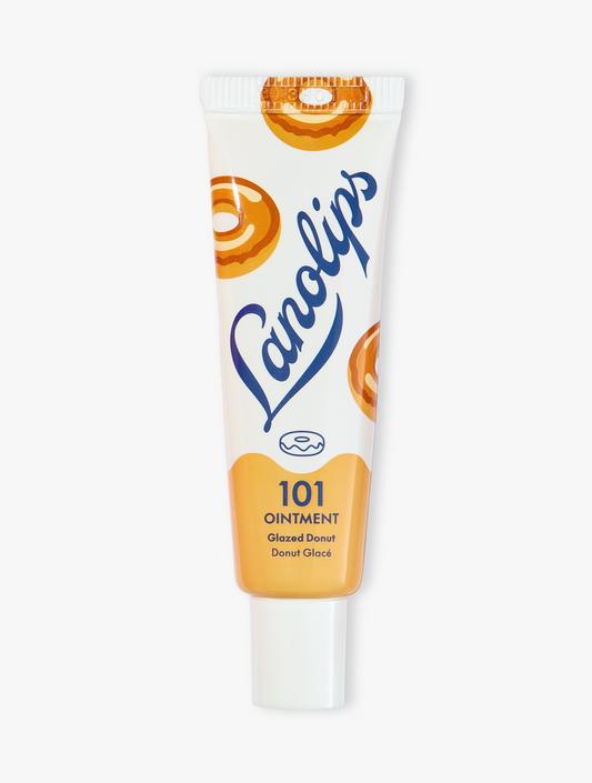 Product shot of the Lanolips 101 Ointment Multi-Balm Glazed Donut, featuring the closed tube. 101 Ointment Multi-Balm Glazed Donut is part of our 101 Delicious lip balm flavours range. DID SOMEONE SAY GLAZED DONUT LIPS? The World's Best Lip Balm has been dipped into a warm sugar-glaze.