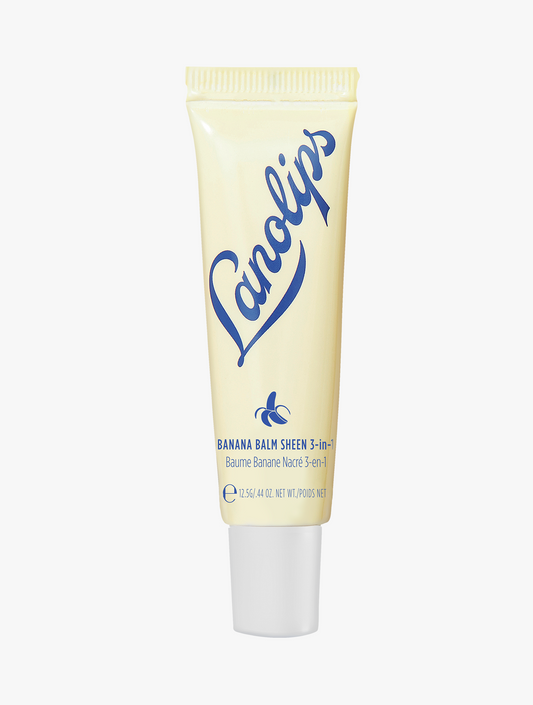 Product shot of the Lanolips Banana Balm Lip Sheen 3 in 1, featuring the closed tube. Banana Balm is creamy and a super-rich 3-in-1 balm with added banana extract to give you soft, hydrated and glowing lips.