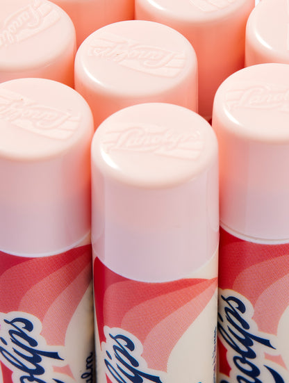 Close-up shot of the Lanolips Basic Balm Strawberry tube. The tubes made from 100% post-consumer-recycled material. 