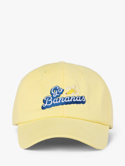 Lanolips Go Bananas Yellow Cap front view. Made with 100% cotton, and the Go Bananas embroidered slogan at the front.
