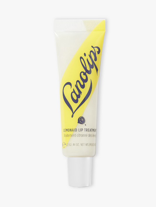 Product shot of the Lanolips Lemonaid Lip Treatment, featuring the closed tube. A rich & creamy whipped lanolin lip treatment with lemon oil to naturally exfoliate, leaving lips fresh, soft & moist.
