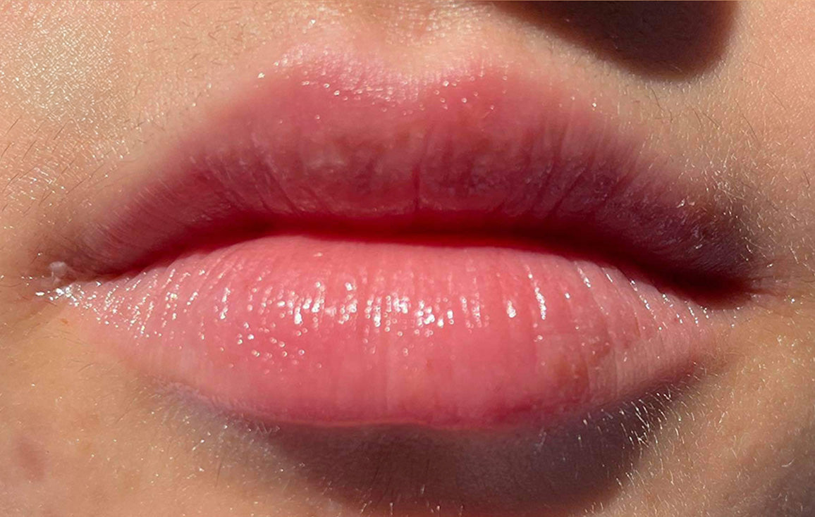 Close up of soft, hydrated lips after using Lanolips 101 Ointment Multipurpose Superbalm. Dryness and chapping visibly reduced after just a few uses. Made with 100% ultra-pure lanolin - Nature’s Wonder Moisturiser - for deep, natural hydration and repair.