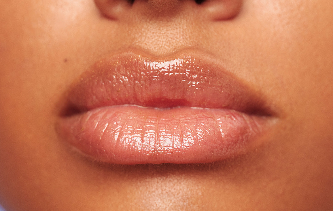 Close up of soft, hydrated lips after using Lanolips Sun Balm SPF 30 Tropical lip balm. This creamy, radiant formula is packed with hydrating lanolin, SPF protection, and a luminous sheen.