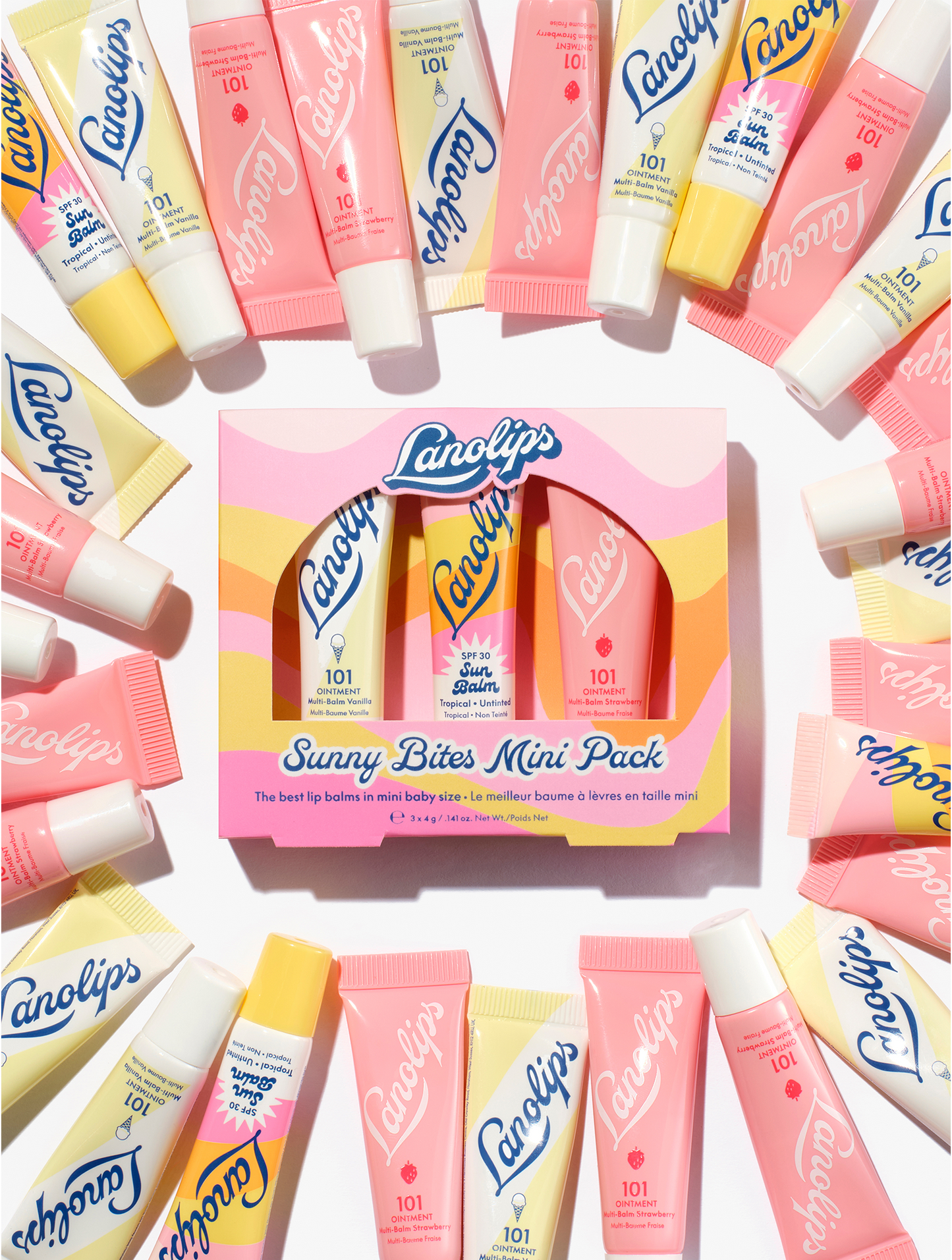 Lanolips sunny bites mini pack containing three mini lip balms, 101 ointment vanilla, strawberry and sun balm spf 30 tropical in a pink and yellow wavy box.