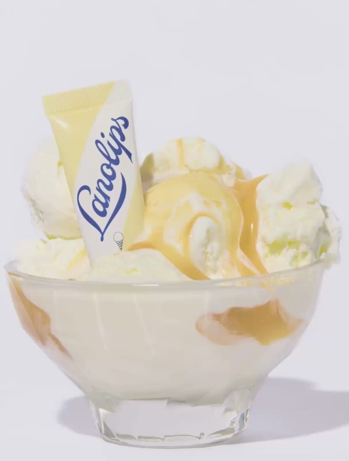 Video of Lanolips 101 Ointment Multi Balm Vanilla with vanilla ice cream. Made with ultra-rich lanolin, infused with vitamin e and natural vanilla extract - this will nourish dry and chapped lips.