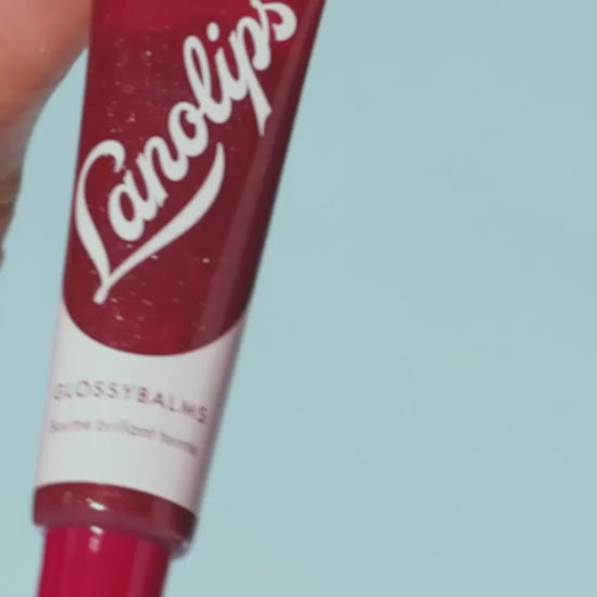 Video of Lanolips Glossy Balms in Candy and Berry. Made with all-natural lanolin, vitamin e and mica, our Glossy Balms range smooths over dryness, seals in moisture and drenches lips in non-sticky hydration that lasts for hours.