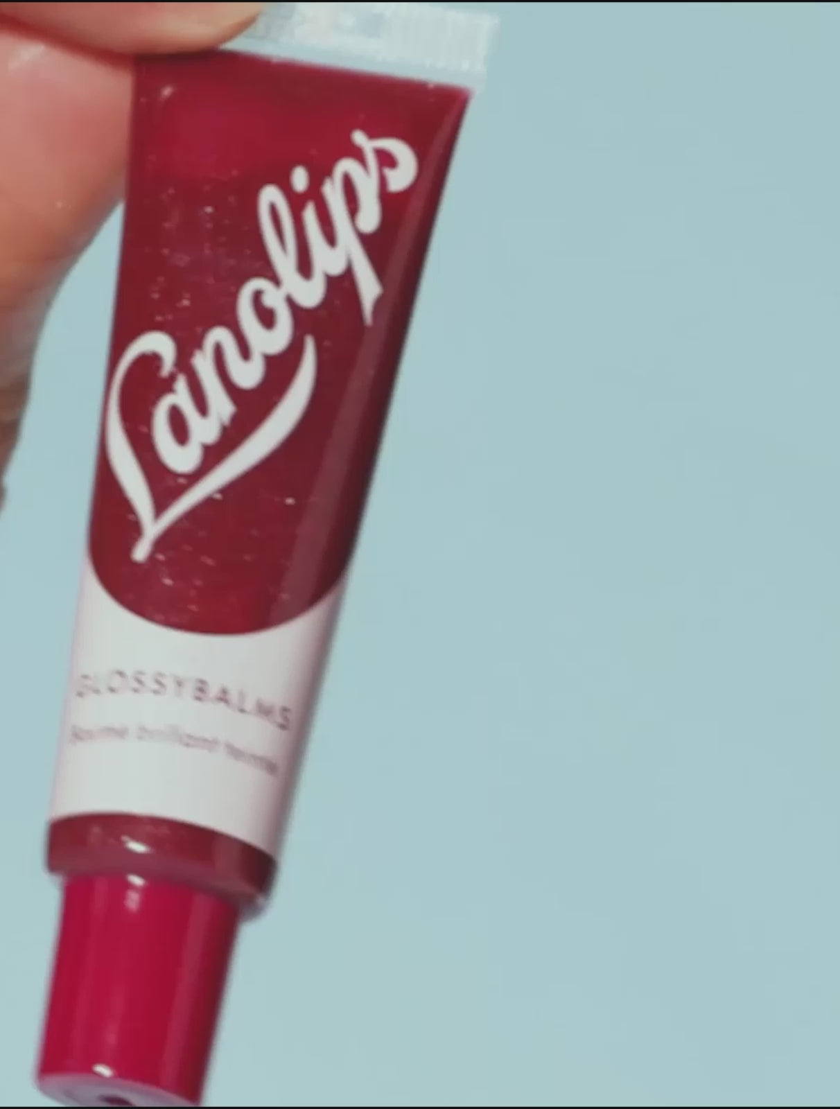 Video of Lanolips Glossy Balms in Candy and Berry. Made with all-natural lanolin, vitamin e and mica, our Glossy Balms range smooths over dryness, seals in moisture and drenches lips in non-sticky hydration that lasts for hours.