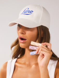 Model holding Lanostick in Original, Coconutter and Minty