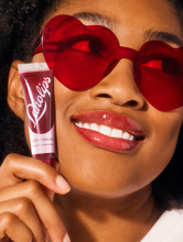 Load image into Gallery viewer, Model wearing Lanolips&#39; Glossy Balm Berry.
