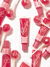 Load image into Gallery viewer, Lanolips&#39; Glossy Balm Candy a fruity pink tint with added gold flecks for the ultimate glossy tint
